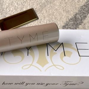 Tyme curling and straightening iron.  Blush color.